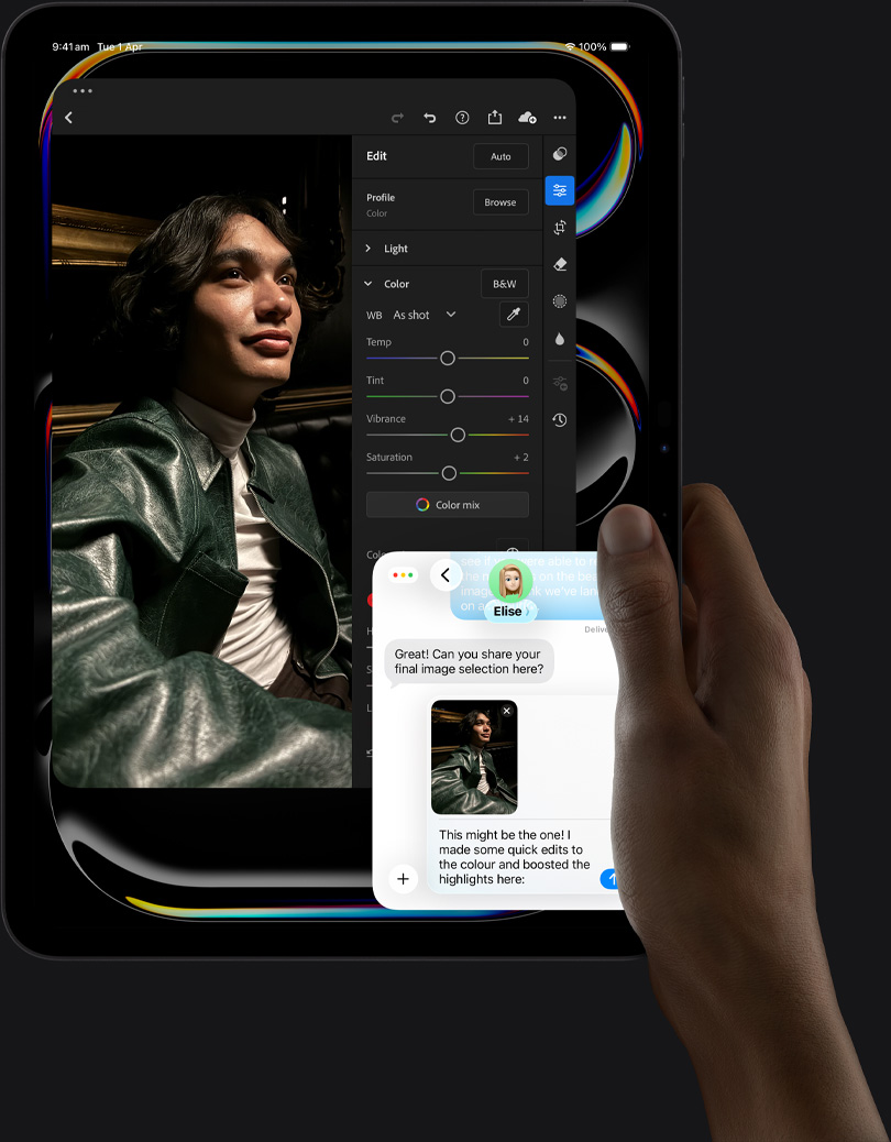 iPad Pro, front exterior, portrait orientation, space black colour, right hand holding device, display showing photo editing app with image of a person in a leather jacket, editing tools and sliders,  iMessage conversation happening between user and another individual reviewing the photo