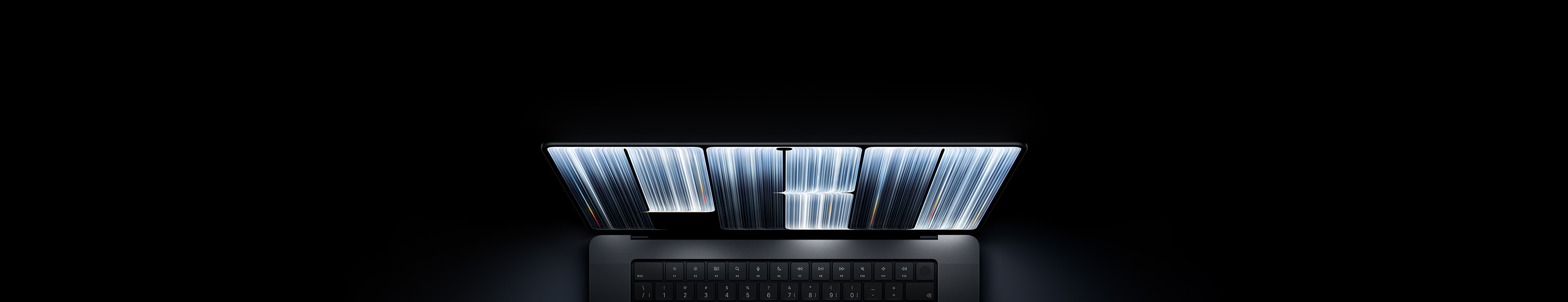MacBook Pro avec écran PROLED XDR, couleur noir infini, l’écran affiche des formes évoquant des rubans avec des bandes lumineuses de différentes largeurs, qui tracent le mot Pro.