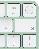 Magic Keyboard, pravý horní roh, zelená barva, Touch ID, klávesa Delete a funkční klávesy na ovládání hlasitosti