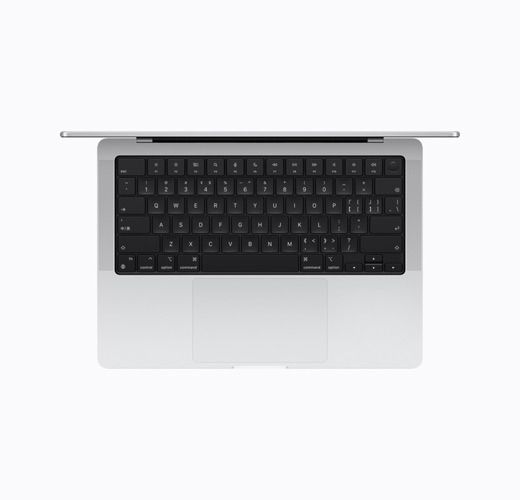 Vista superior del interior de un MacBook Pro en plata abierto