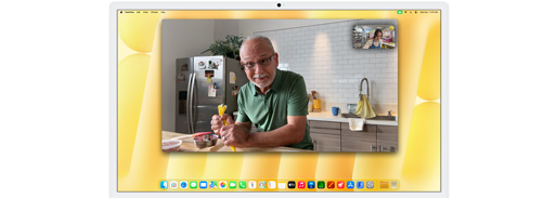 Desk View demonstration. Person on a video call watching top-down view of a baker decorating a cookie.