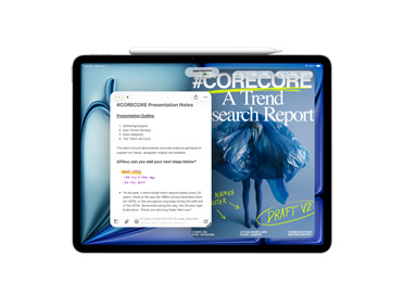 iPad, front view, displaying a presentation app with notes and a trend search report, with an Apple Pencil resting on top of the screen