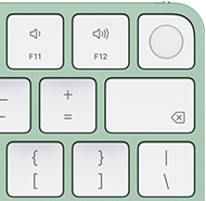 Klawiatura Magic Keyboard, prawy górny róg, kolor zielony, czytnik Touch ID, klawisz Delete i klawisze regulacji głośności