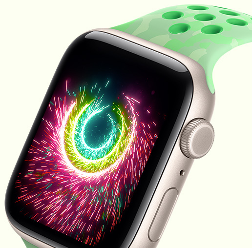 Apple Watch SE 3, aluminum case, starlight color, Activity rings sparking like fireworks, Nike Sport Band, green spark color (mint green, subtle pattern of gray shapes, circular perforations)