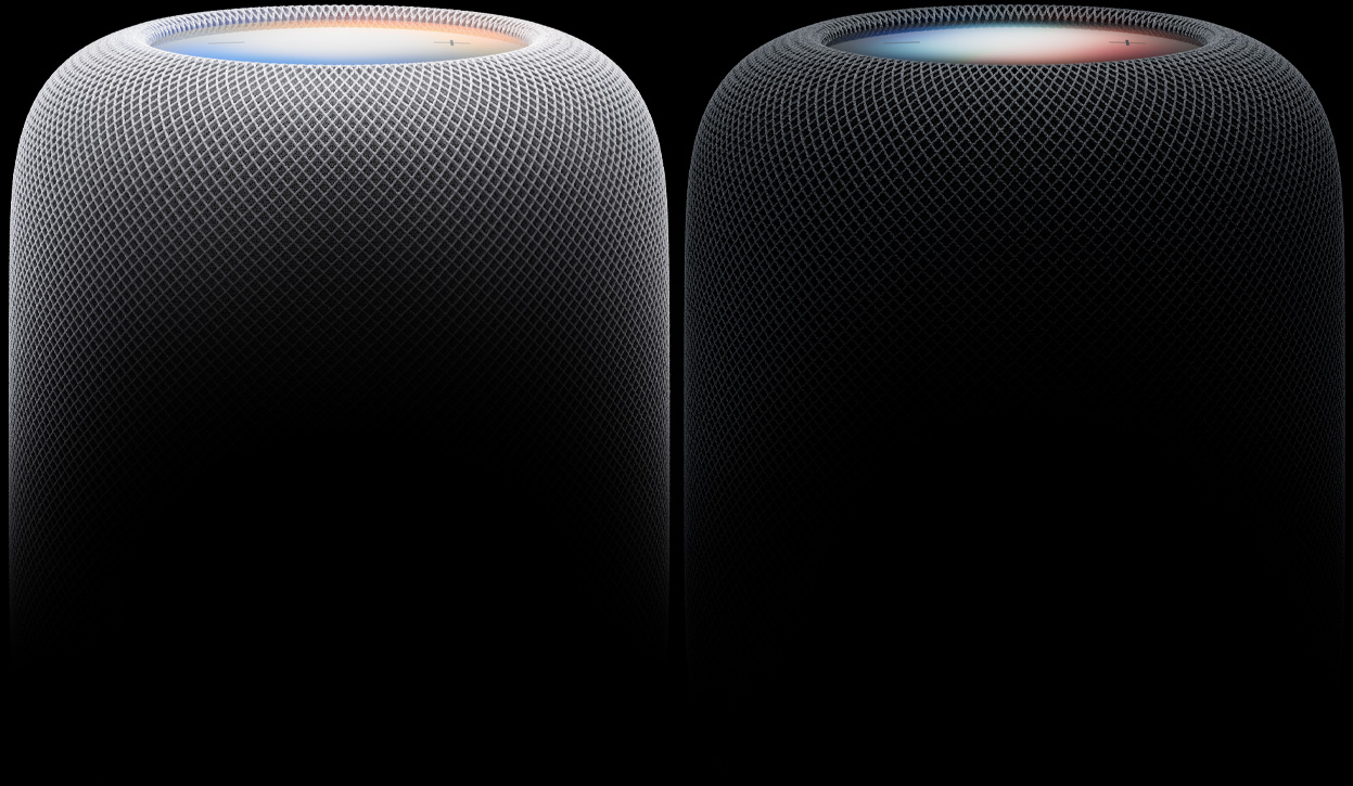 Two HomePod speakers side by side, white colour and midnight colour, woven acoustic mesh fabric, illuminated touch surfaces