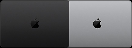 配備 PROLED XDR 顯示器的太空黑 MacBook Pro 的俯視圖，呈合上狀態；以及配備 PROLED XDR 顯示器的銀色 MacBook Pro 的俯視圖，呈合上狀態