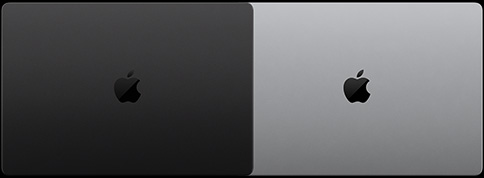 配備 PROLED XDR 顯示器的太空黑 MacBook Pro 的俯視圖，呈合上狀態；以及配備 PROLED XDR 顯示器的銀色 MacBook Pro 的俯視圖，呈合上狀態